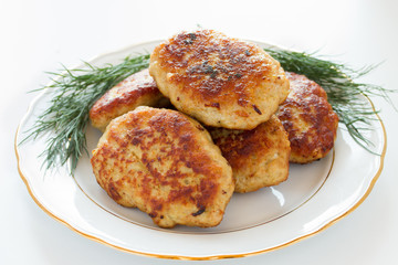Fried cutlet with dill on a plate