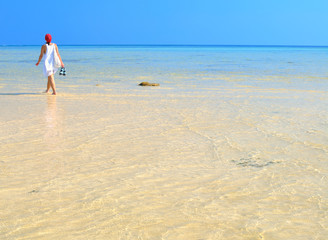 Woman walking on the beach