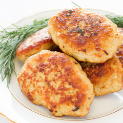 Fried meatballs with dill on a plate
