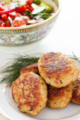 Meat patties with dill on a plate
