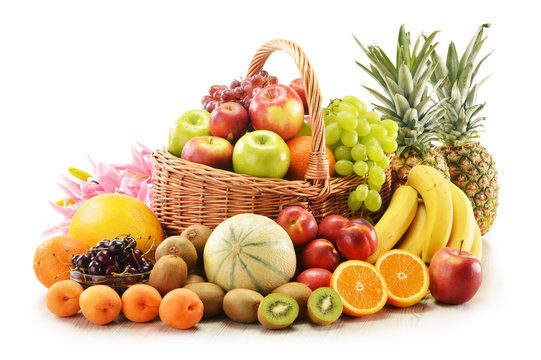 Fototapeta Composition with assorted fruits in wicker basket