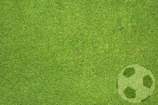 football on green grass texture and  background