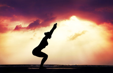 Yoga silhouette on the beach