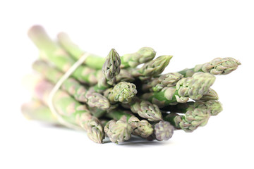 Bunch of fresh organic green asparagus on white background