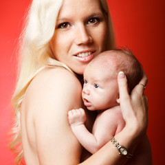 Young mother holding her baby.