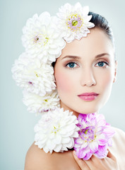 woman's face surrounded by flowers