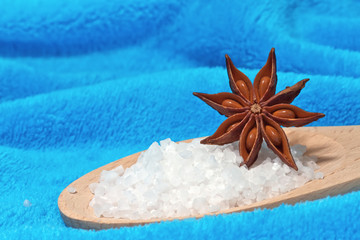 Sea salt bath with a star anise on a blue background