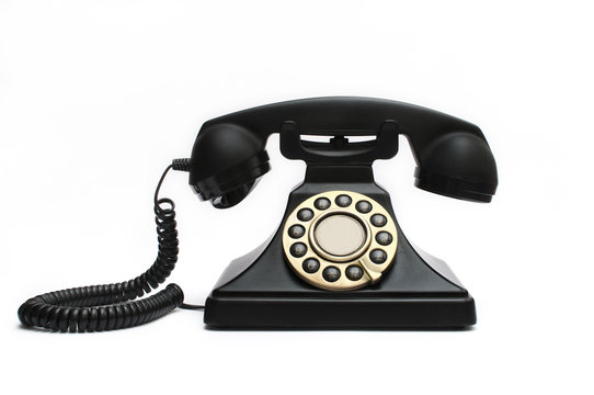 Vintage black telephone isolated on white background