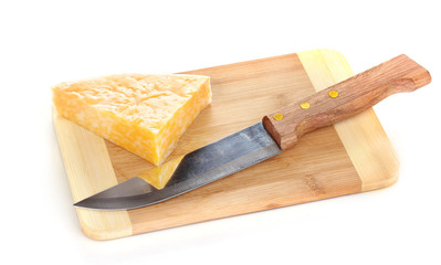Cheese on cutting board with knife isolated on white
