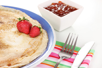 Stack of tasty pancakes isolated on white