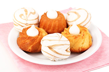 Appetizing cupcakes with cream isolated on white