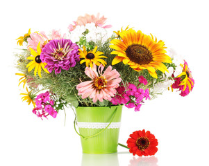 Beautiful bouquet of bright flowers in pail isolated on white