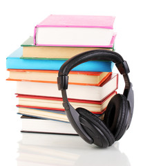 Headphones on books isolated on white