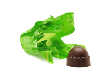 Chocolates and candy wrapper isolated on white background