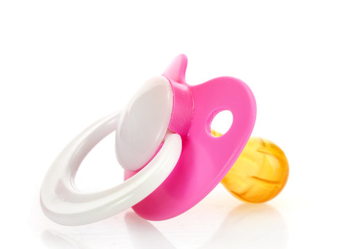 pink baby's pacifier isolated on white background