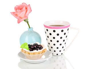 sweet cake with cup of tea isolated on white