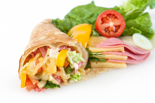 thin pancakes with ham, cheese and vegetables