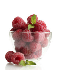 ripe raspberries with mint in glass bowl isolated on white