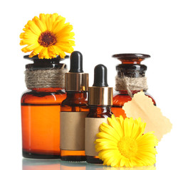 medicine bottles and beautiful calendula flowers, isolated