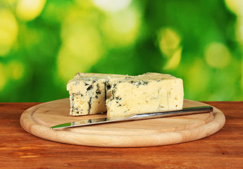 Cheese with mold and knife