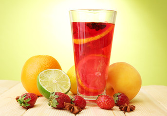 Refreshing sangria in glass with fruits,