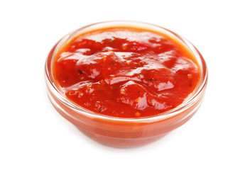 Tasty ketchup in bowl isolated on white