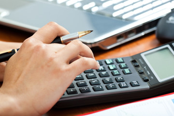 Businessman using a calculator