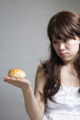 hungry beautiful girl eats a tasty hamburger