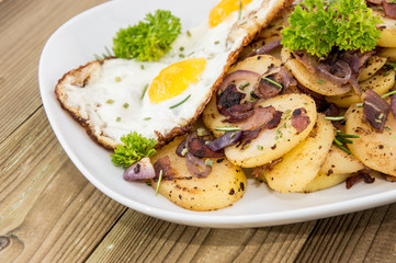 Plate with fried Potatoes and Egg