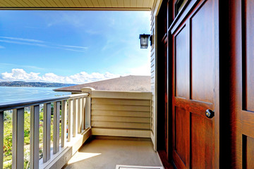 Front luxury wood door with water view.