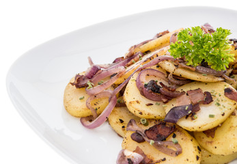Plate with fried Potatoes on white