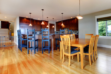 Luxury home kitchen and dining room with open floor plan.