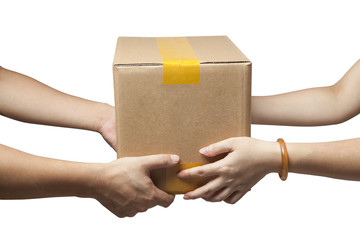 Close-up of the hands of two people holding a box