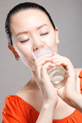 Young Woman with a glass of milk