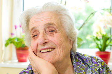 Happy old gray-haired woman