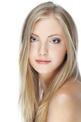 Naklejka premium Closeup portrait of young woman with beautiful blue eyes on whit