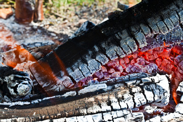 Decaying coals for cooking and a background