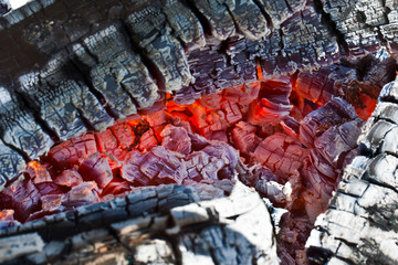 Decaying coals for cooking and a background