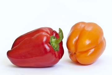 Red and yellow paprika on white background