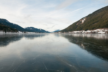 Mirror ice of mountain lake