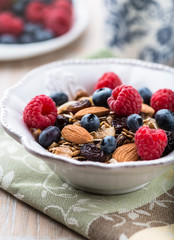 Muesli with fresh fruits, almonds and raisins