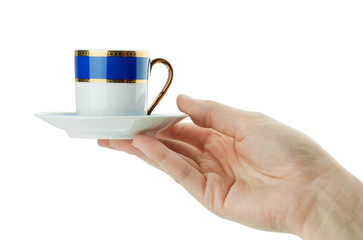 Hand holds cup
