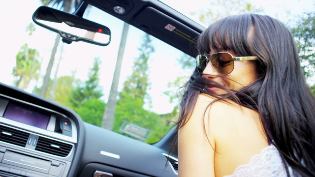 Beautiful Girls Listening Music Driving Convertible Car