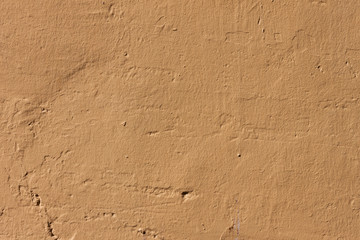 Simple yellowed plaster cement wall background