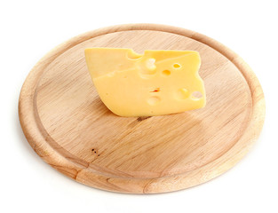 Cheese on cutting board isolated on white