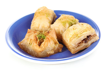 Sweet baklava on plate isolated on white