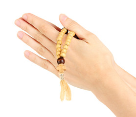 Naklejka premium Hands in Prayer with Crucifix on white background close-up
