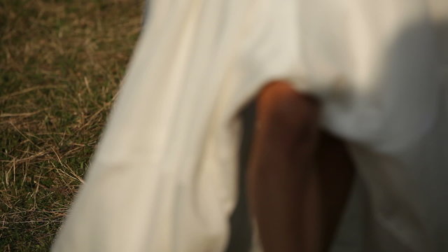 Bride running across the field