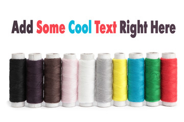 Few bobbins isolated on white