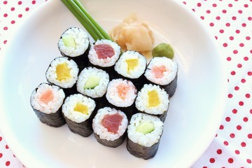 Hosomaki sushi  tuna, smoked salmon and vegetables inside